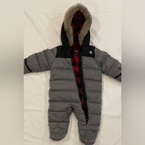 6-12 month snow suit with gloves on.